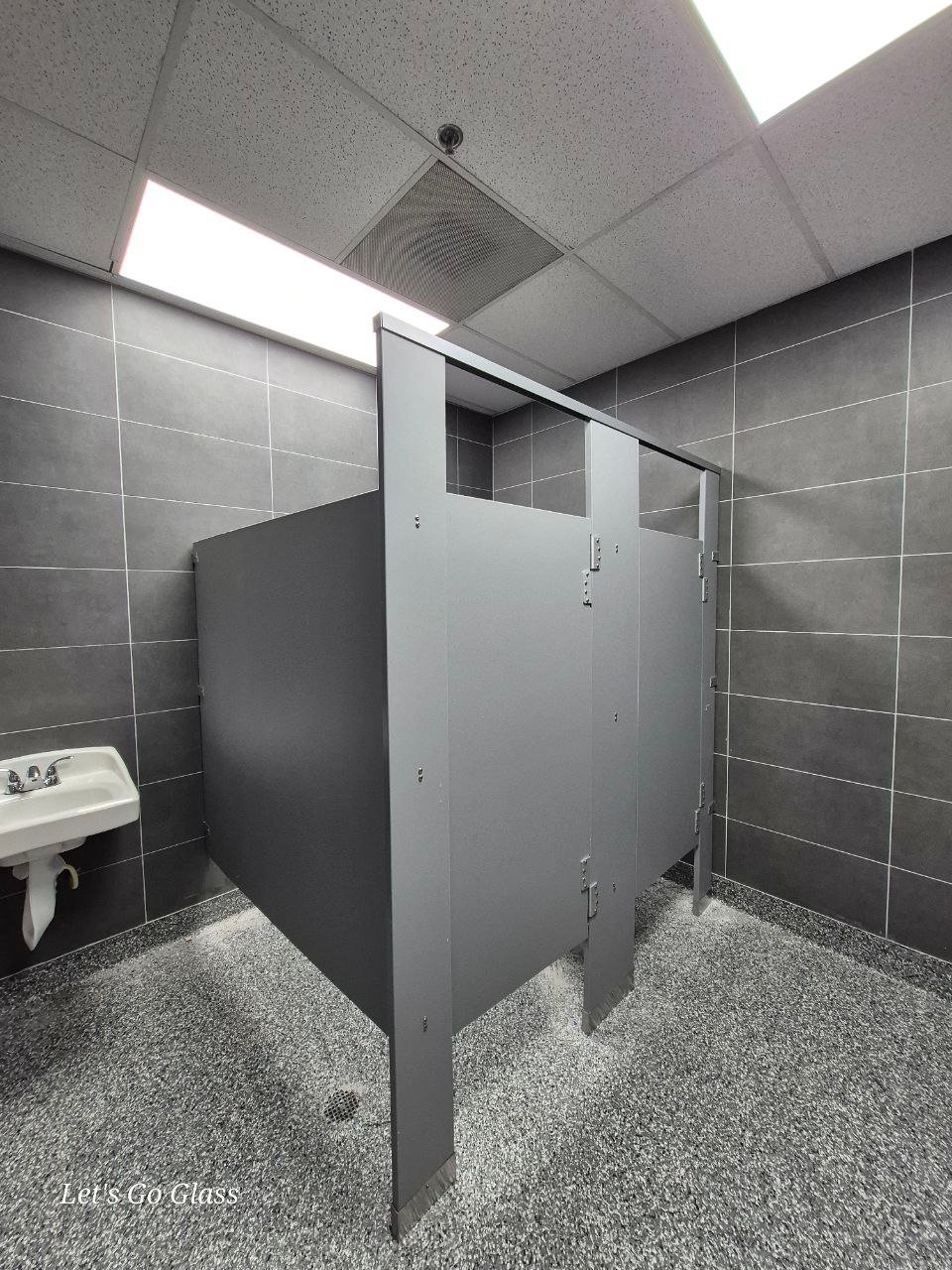 Commercial restroom partitions installed by Let's Go Glass